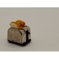 Br�drister i metal, men 2 skiver toastbr�d (brugt)