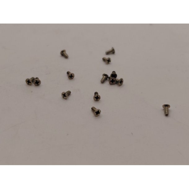 14 meget sm� skruer i metal (brugte)