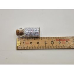 Glas med korkprop og sm glimmer stjerner (brugt)