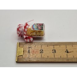 Krukke i glas med indhold og stof lg (brugt/som ny)