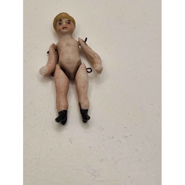 Meget lille dukke i porceln (antik)